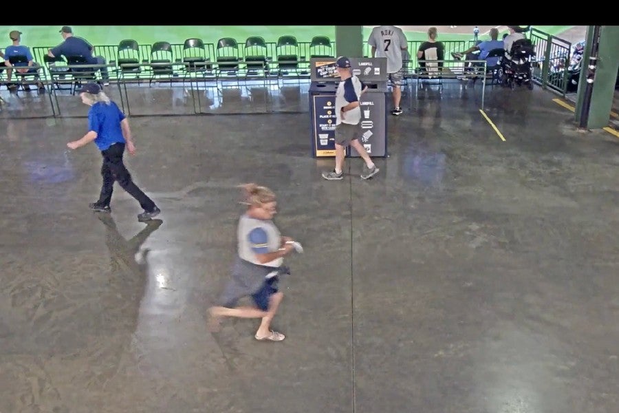 Security video shows Flynn racing to turn in her raffle ticket inside the American Family Field stadium (Landon Flynn/YouTube)