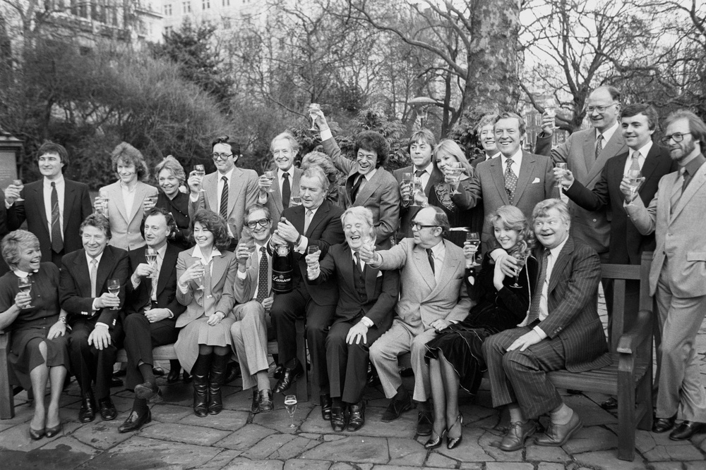 A galaxy off Thames Television stars gathered in London. They included, left to right, back row; Peter Tilbury, Jim Davidson, Pauline Yates, Ian Ogilvy, Robin Bailey, Janet Brown (obscured), Lionel Blair, Hywel Bennett, Sue Upton, unidentified, Eamon Andrews, Andrew Gardner, Peter Marshall and Dennis Waterman. Front row; Judith Chalmers, Max Bygraves, Paul Eddington, Nanette Newman, Denis Norden, Bryan Cowgill, Thames Television managing director, Ernie Wise, Eric Morecambe, Trudi Miller and Benny Hill (PA) (PA Archive)