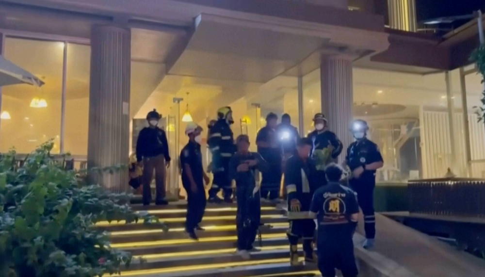 At least three people including two Thai women and one Indonesian boy were treated for inhaling smoke (AP)