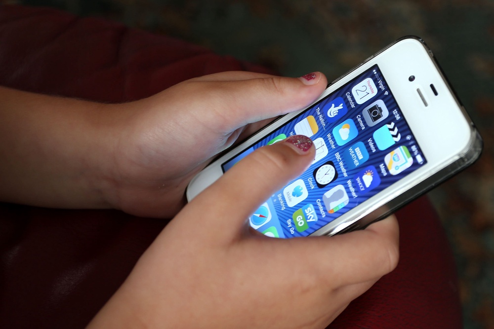 The government is seeking to force firms such as Apple and Google to activate built-in features on their devices or come up with technological solutions to detect and block nude images (PA)