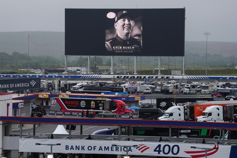 An in memoriam photo of former driver Kyle Busch is displayed on the video board of the backstretch at Charlotte Motor Speedway, Friday, May 22, 2026 (AP Photo/Matt Kelley)