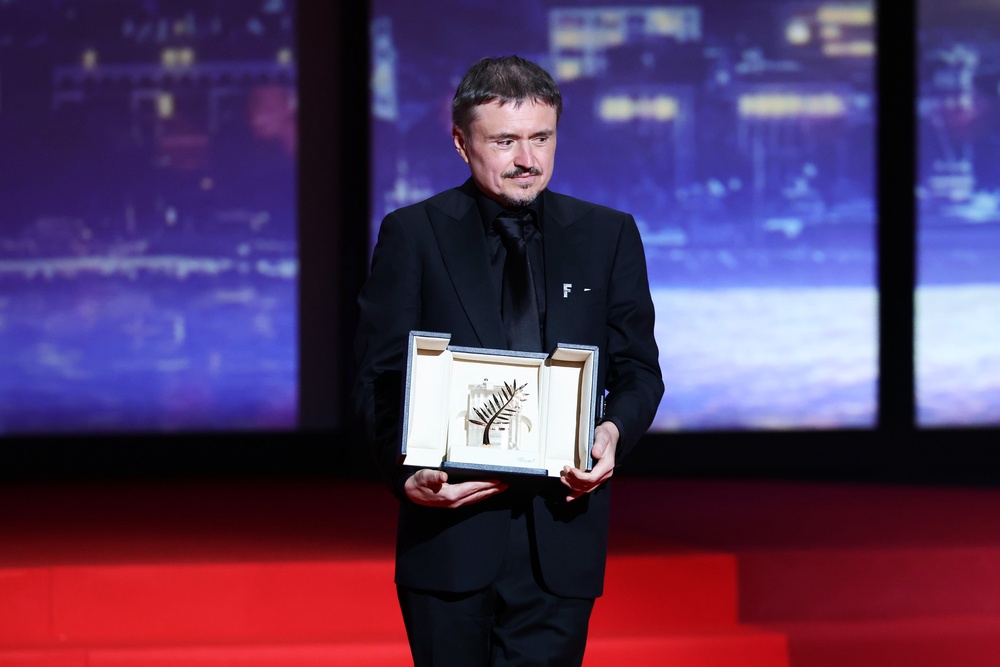 Cristian Mungiu accepts the Palme d’Or on stage during the closing ceremony of the 79th annual Cannes Film Festival at Palais des Festivals on 23 May 2026 in Cannes, France (Getty)