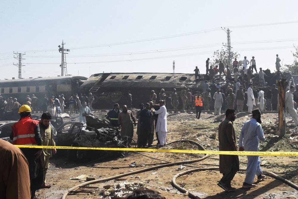 Security personnel inspect damaged derailed carriages after an explosion targeted a train in Quetta (AFP/Getty)
