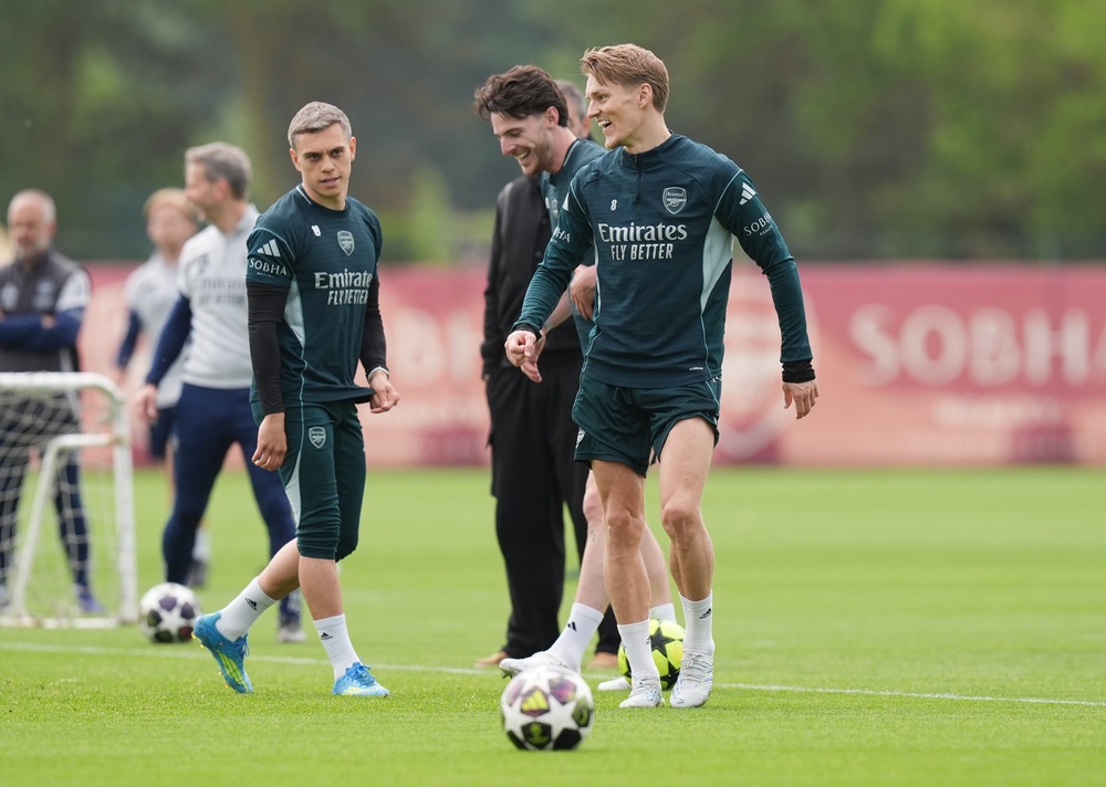 Arsenal's Martin Odegaard and Declan Rice during the training session (PA)