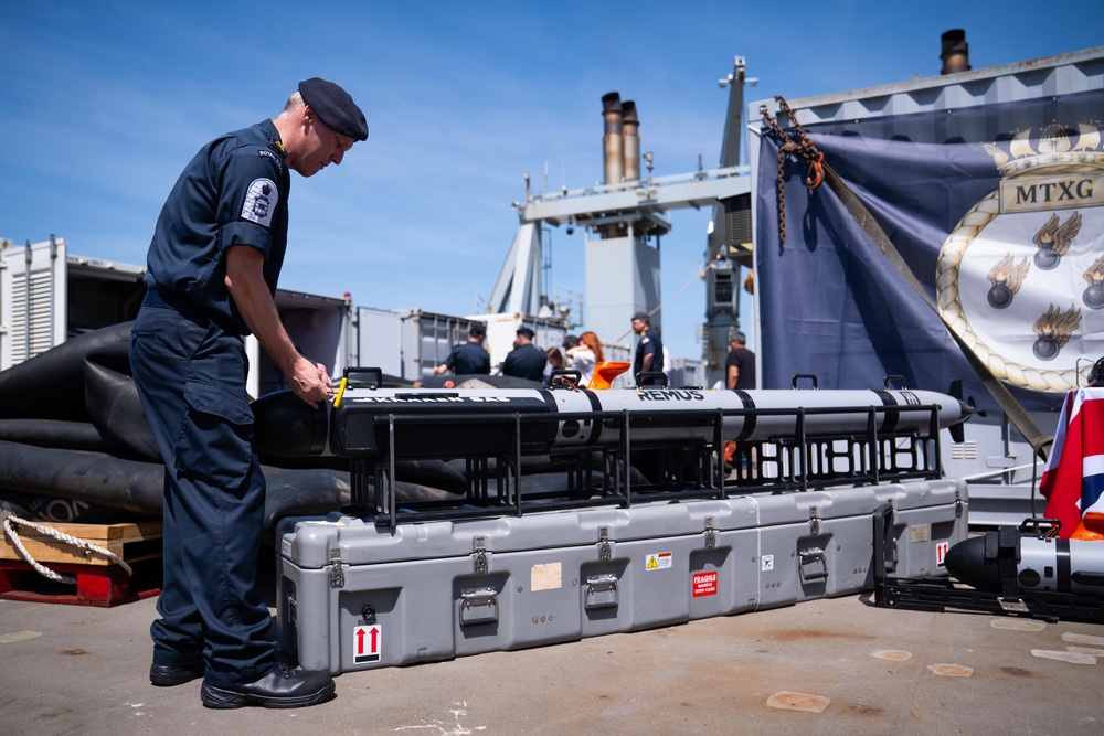 A member of the Royal Navy works on mine hunting equipment on the RFA Lyme Bay in Gibraltar, (Getty)