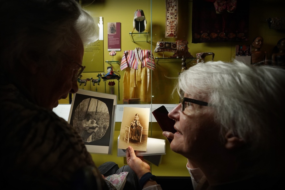 Dr Friederike Voigt reuniting Mary Davidson Smith (left), 104, with the traditional Korean outfit she wore almost 100 years ago at the National Museum of Scotland (PA)