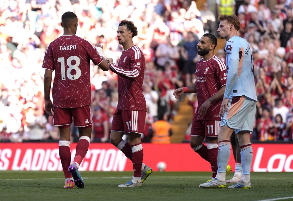 Salah, second right, set up Curtis Jones’ opener at Anfield (Peter Byrne/PA)