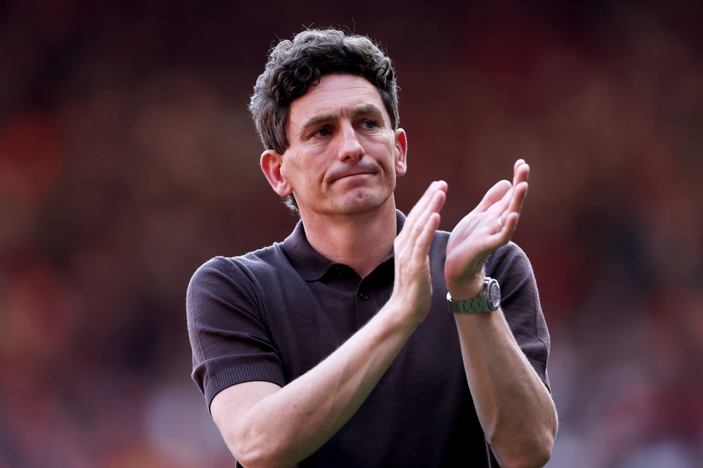 Keith Andrews, Manager of Brentford, applauds the fans after keeping the Bees in the Premier League (Getty)