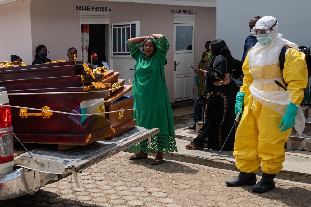 A woman mourns an Ebola victim as the coffin is take away for burial, at Sofepadi Hospital in Bunia, Congo, Saturday, May 23, 2026 (AP Photo/Moses Sawasawa)