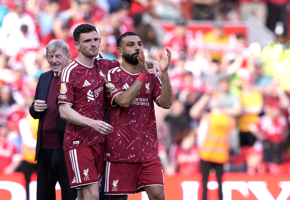Salah and Andy Robertson were emotional after full-time at Anfield (Peter Byrne/PA) (PA Wire)