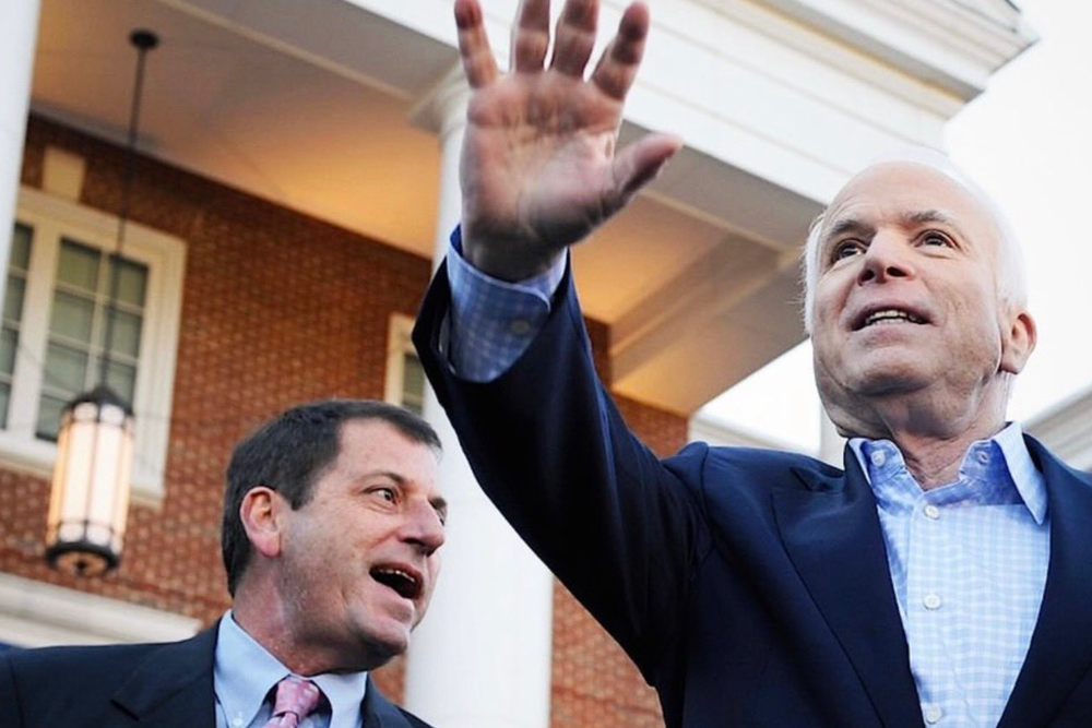 McCain (left), pictured with his adopted father John (McCain Institute)