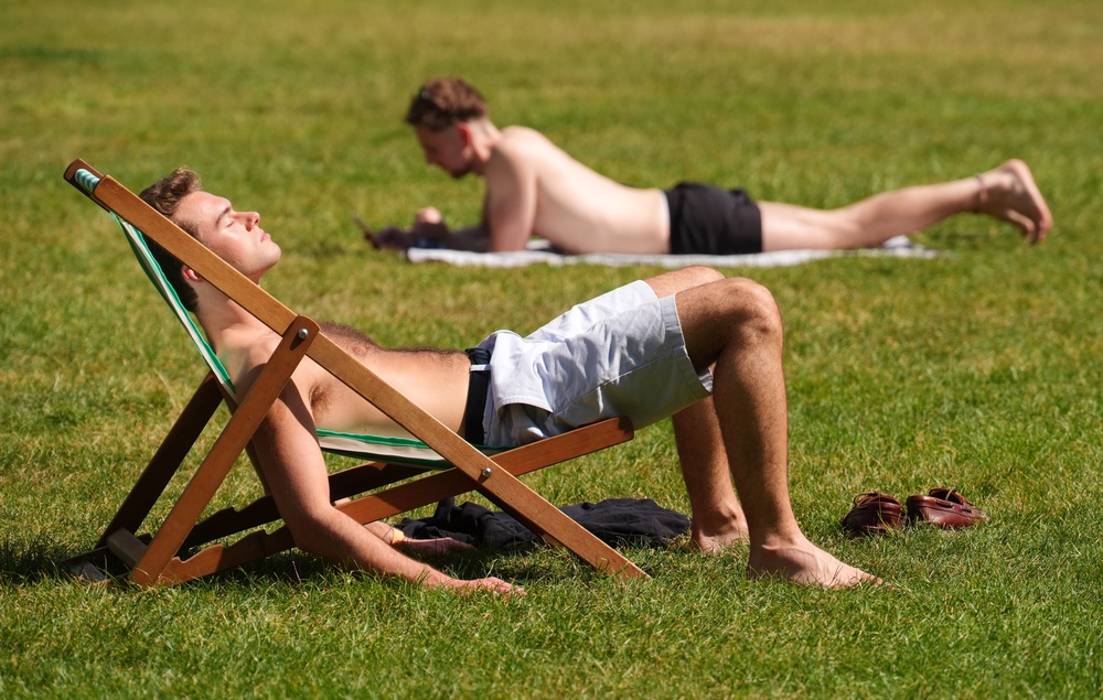 Visitors to Green Park, London, enjoy the sunshine (PA Wire)