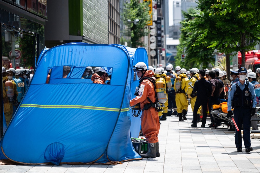 Emergency personnel at the Ginza Six shopping centre in Tokyo on 25 May 2026 (AFP via Getty Images)