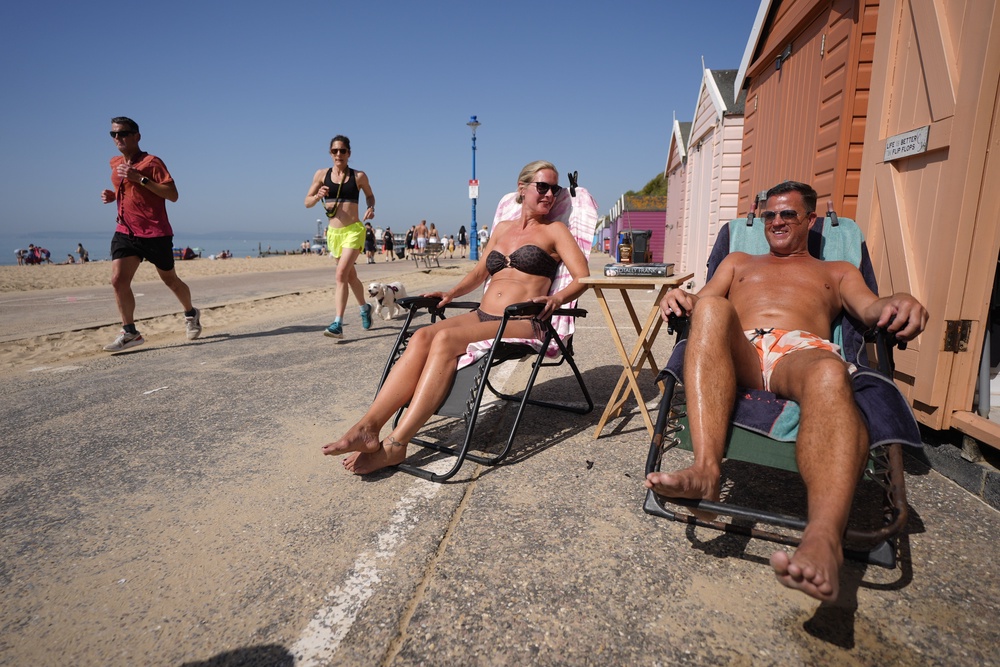 People enjoy the hot weather on Bournemouth beach in Dorset (Andrew Matthews/PA) (PA Wire)