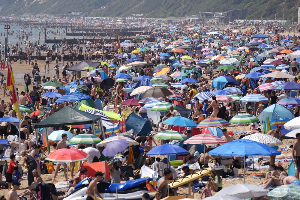 Bournemouth beach was a patchwork of bright umbrellas and sunshades (Andrew Matthews/PA) (PA Wire)
