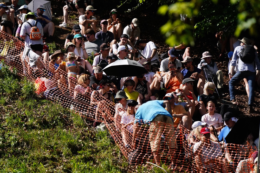 Spectators found some shade on the side of the steep course (Jacob King/PA) (PA Wire)