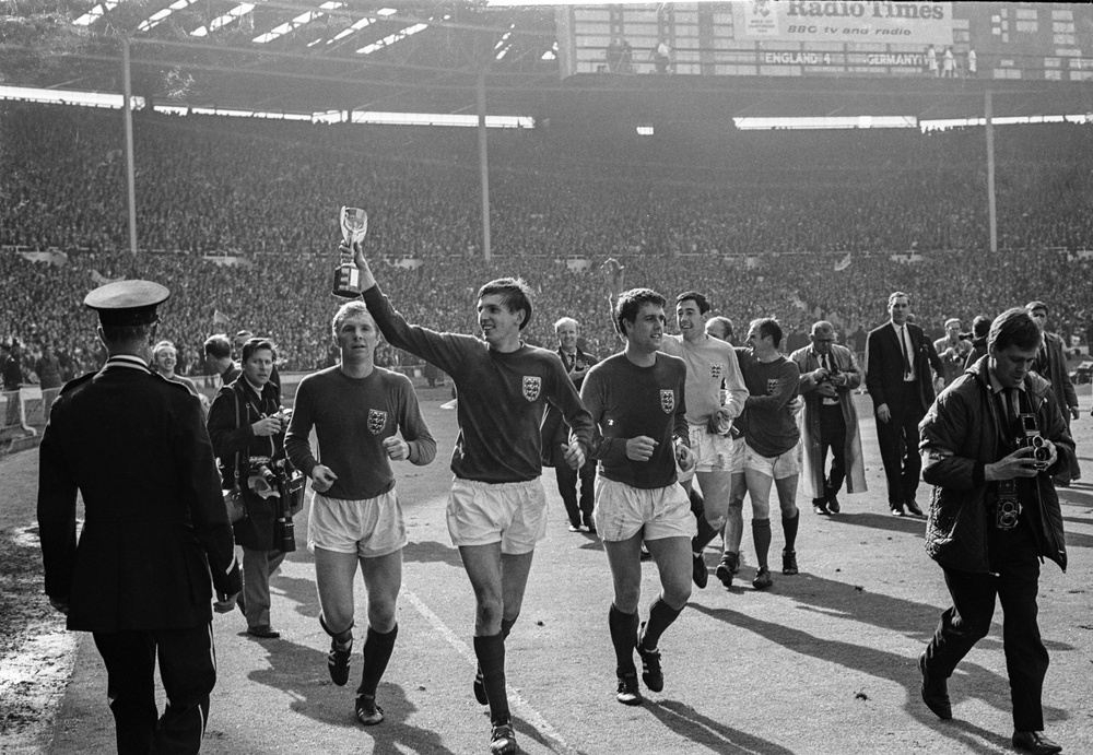 Martin Peters (centre) holds the trophy aloft after England's 1966 victory (Getty)