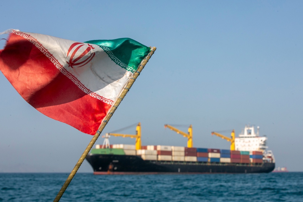 An Iranian flag flutters in the Strait of Hormuz (Getty)