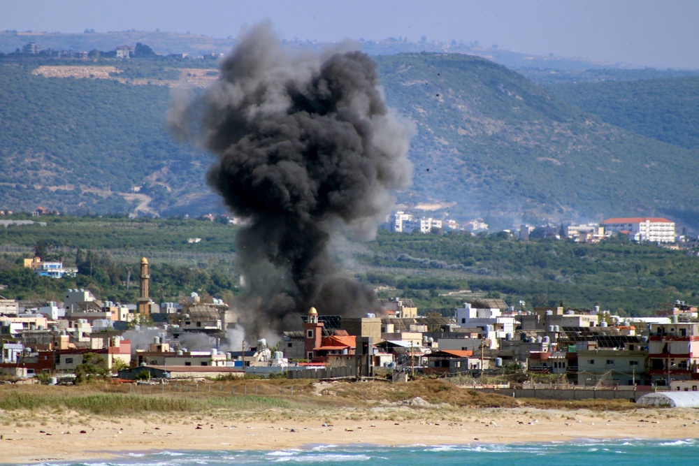 As the war in the region continues, smoke rises following an Israeli airstrike on the Rashidieh Palestinian refugee camp in the Tyre district of southern Lebanon. (AFP/Getty)