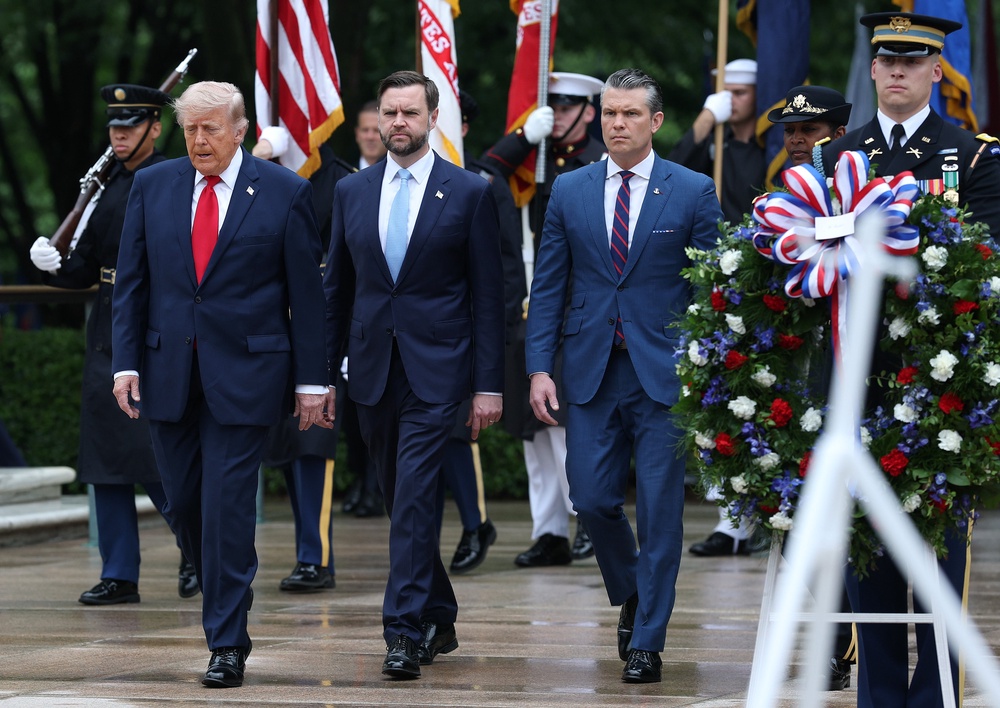 US president Donald Trump, vice president JD Vance and secretary of war Pete Hegseth participate in a Memorial Day wreath-laying ceremony (Getty)