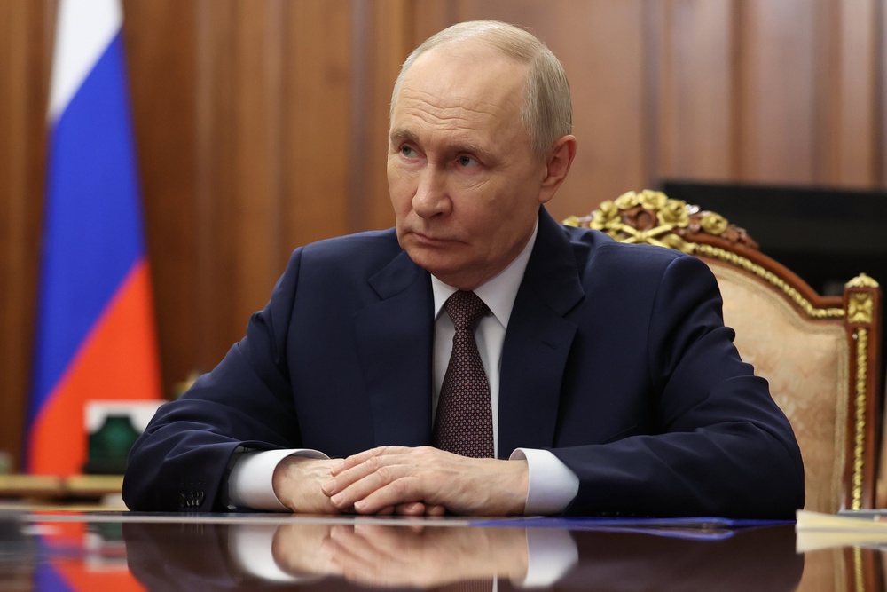 Russian president Vladimir Putin during a meeting at the Kremlin in Moscow (AP)