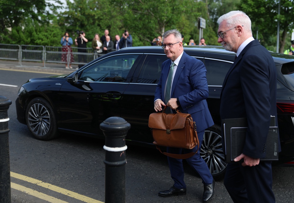 Sir Jeffrey Donaldson (centre) with his solicitor John McBurney as he arrives at Newry Crown Court (Liam McBurney/PA) (PA Wire)