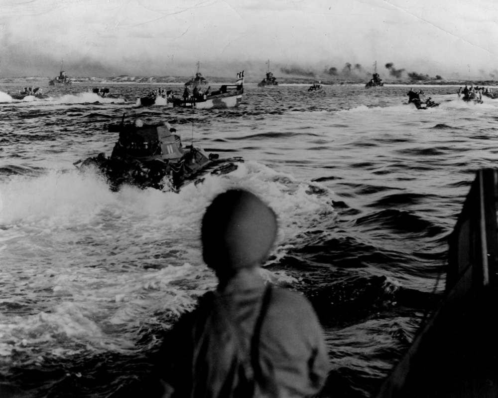 1945: American amphibious tanks and landing craft approach the beach at Aguni Jima, 30 miles west of Okinawa (Getty)