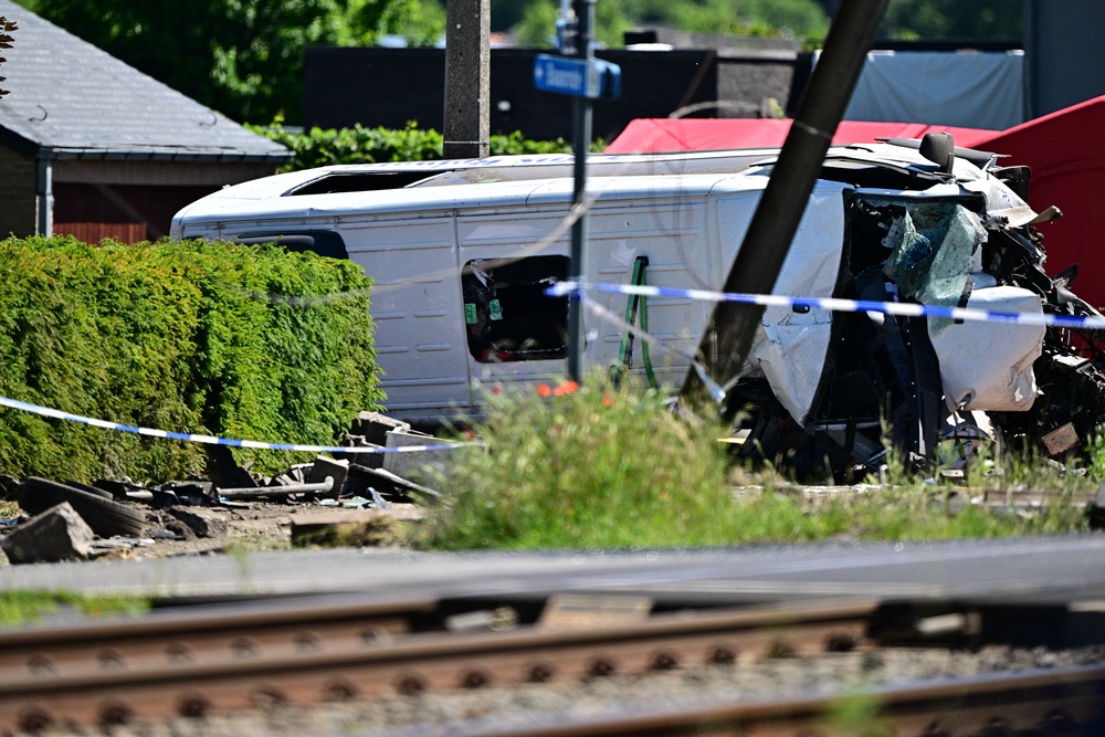 The scene of an accident between a train and a minivan, at the railway crossing Vierhuizen, in Buggenhout (AFP/Getty)