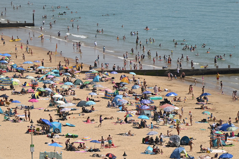 Sunbathers relax in the sunshine on Bournemouth beach on Tuesday (AFP/Getty)