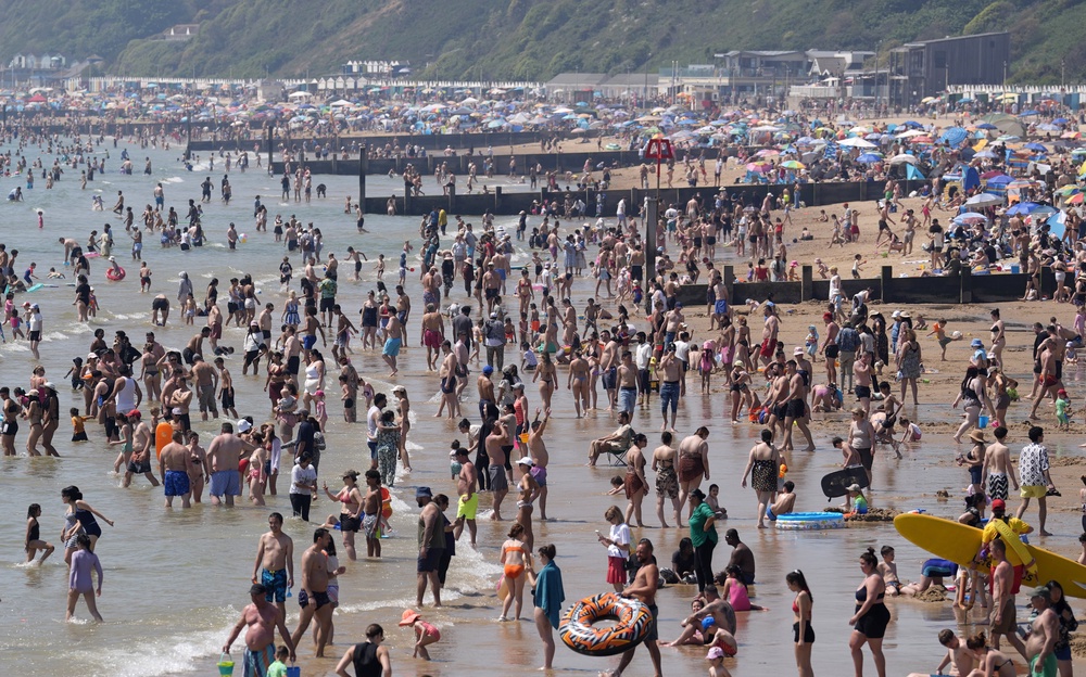 People enjoy the hot weather on Bournemouth beach in Dorset on Monday (Andrew Matthews/PA) (PA Wire)