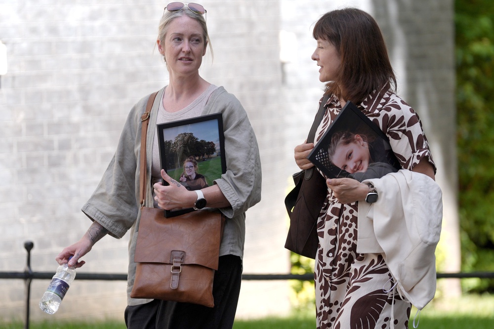 Esther Ghey (left) and Ruth Moss, both holding a picture of their daughters, arrive at Downing Street for a meeting with Prime Minister Sir Keir Starmer (Stefan Rousseau/PA) (PA Wire)
