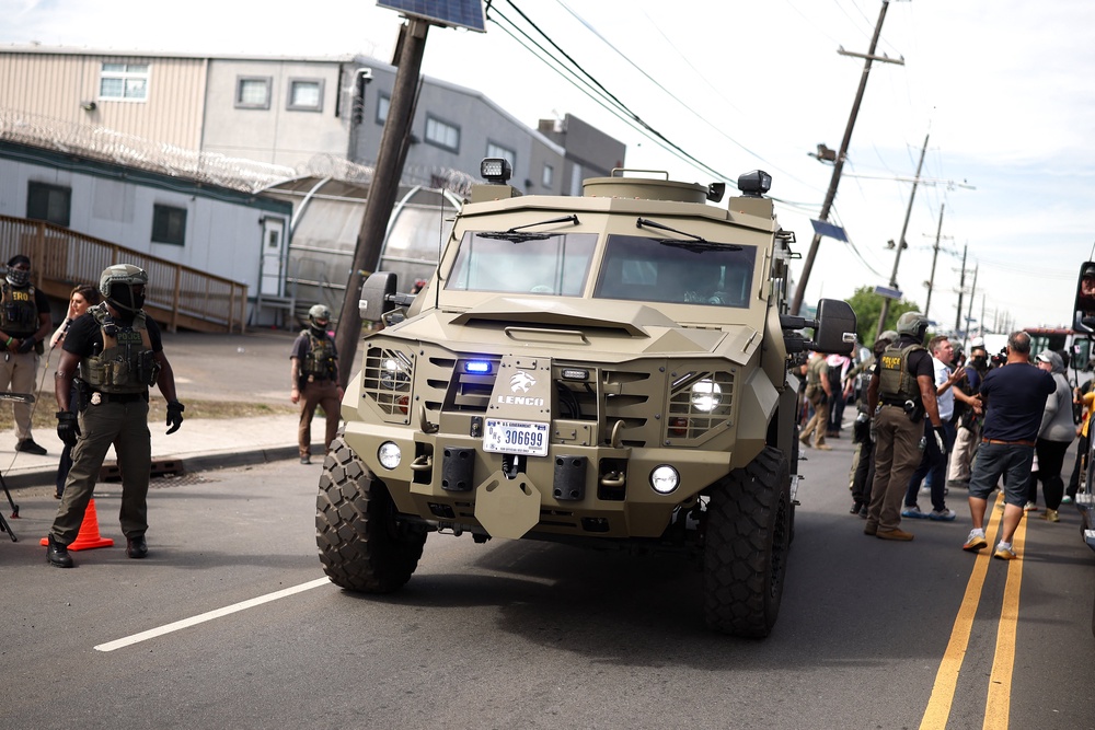 Armored police vehicles joined ICE agents in military gear on May 26 as protesters returned to Delaney Hall to demand the release of detainees inside the controversial detention center (AFP/Getty)