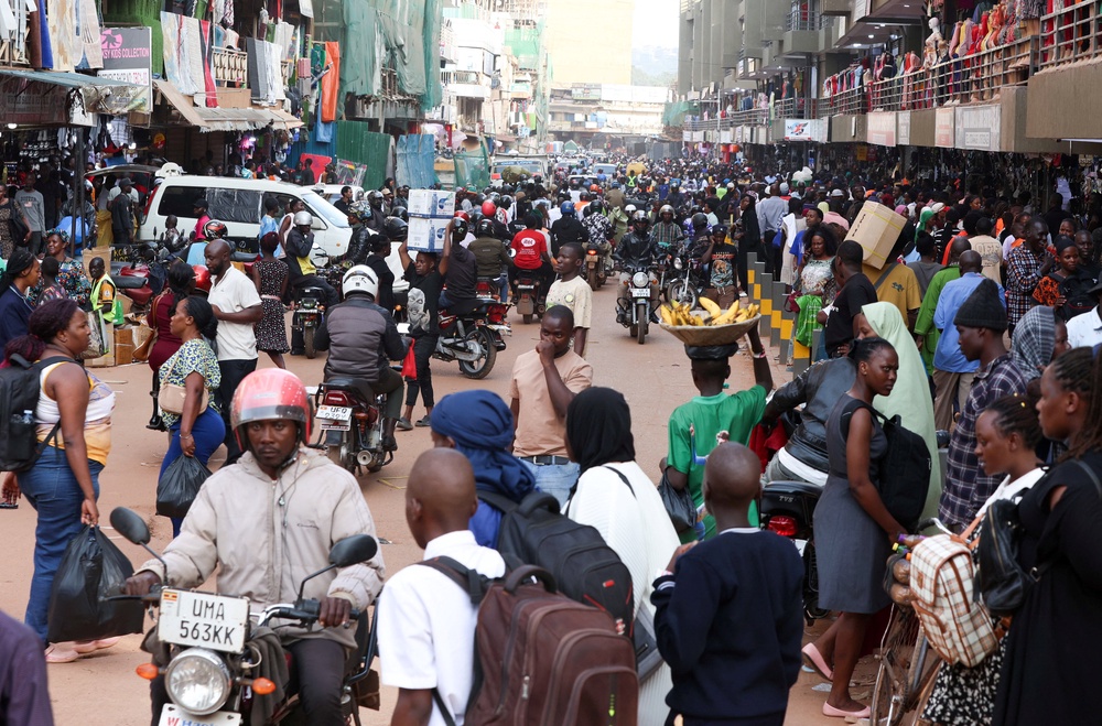 Pedestrians walk along a street as authorities intensify efforts to contain a new Ebola outbreak caused by the Bundibugyo virus, in downtown Kampala, Uganda, 26 May 2026 (Reuters)