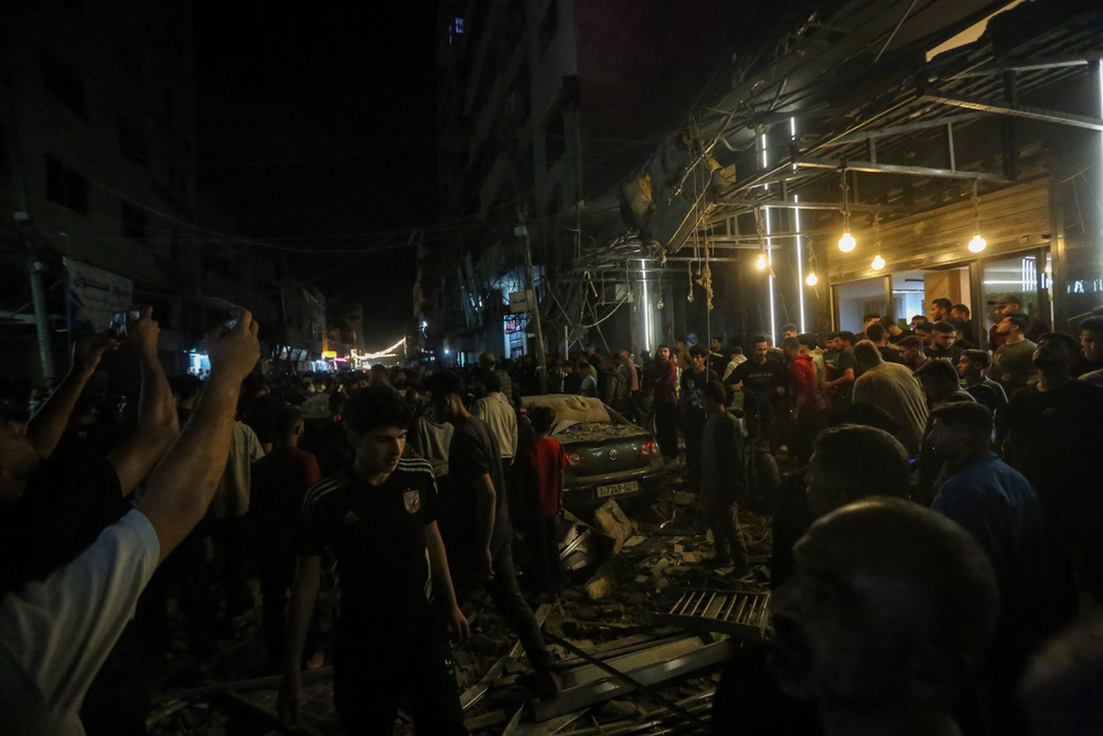 Emergency teams arrived at the scene following Israeli airstrikes on a residential building in the Rimal area of ​​Gaza City that is believed to have killed Odeh (Getty)