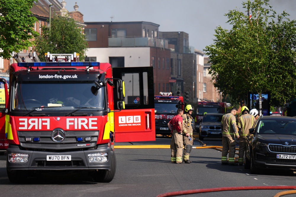 Around 100 firefighters are at the scene (PA)