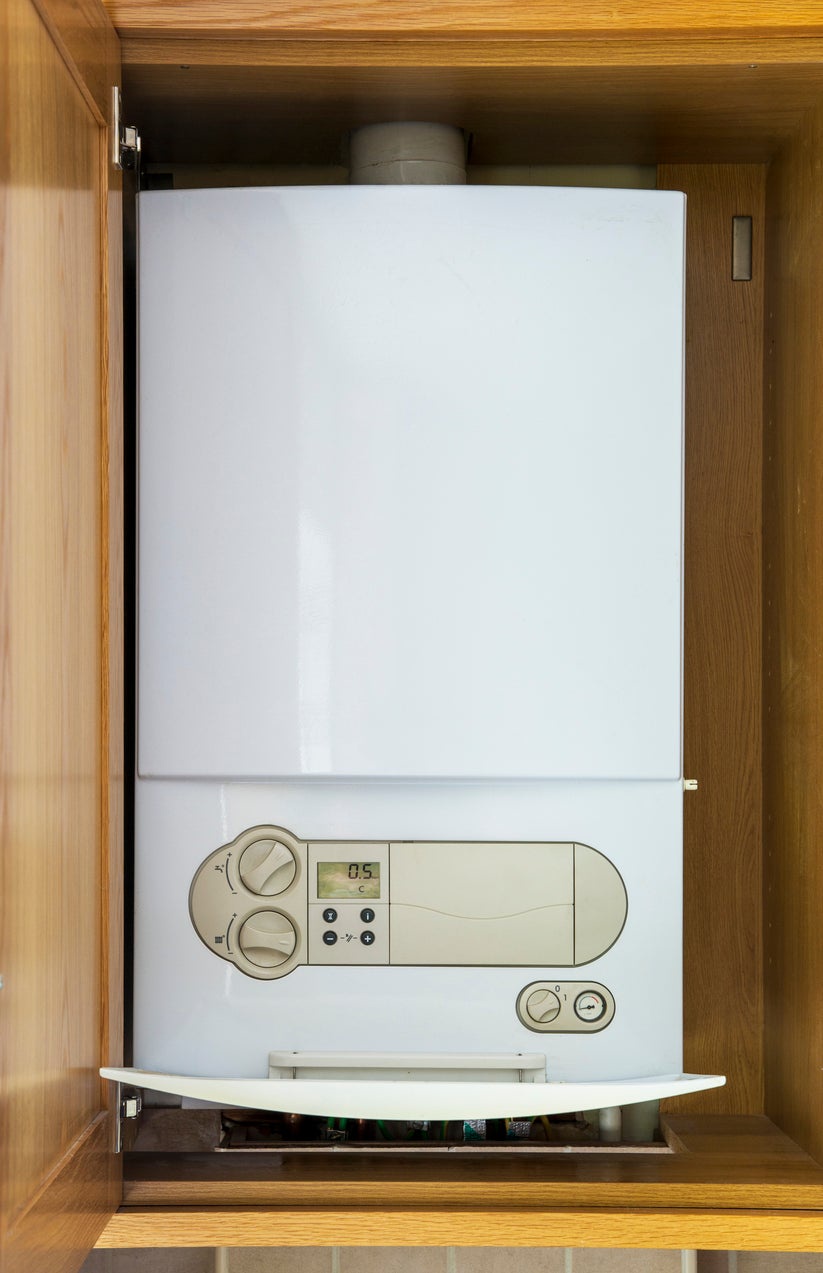 A modern condensing boiler recovers extra heat from waste gases, helping it run more efficiently than older non-condensing models. (Getty Images)