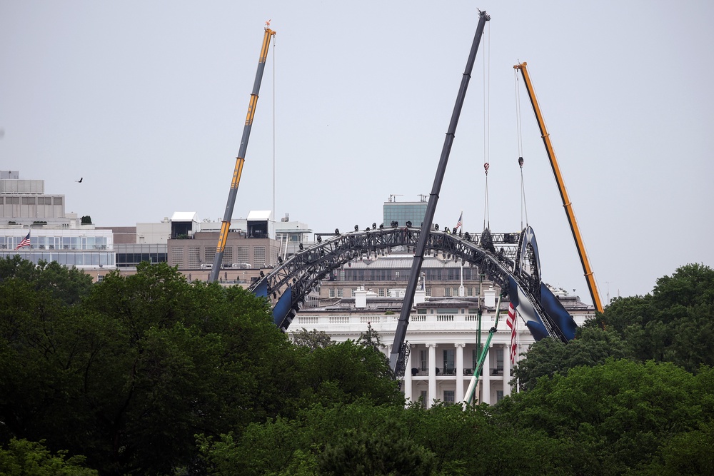 This week, cranes were seen assembled massive lighting rigs on the South Lawn in preparation for the UFC event (Getty)