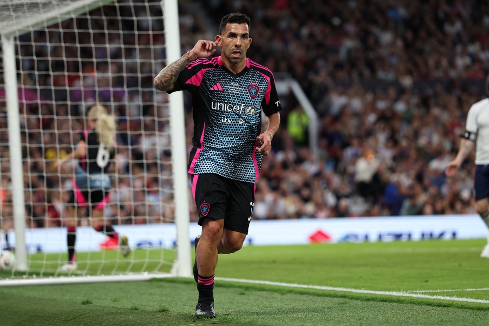 Argentine former footballer Carlos Tevez celebrates after scoring his and the World XI's fourth goal in 2025 (AFP/Getty)