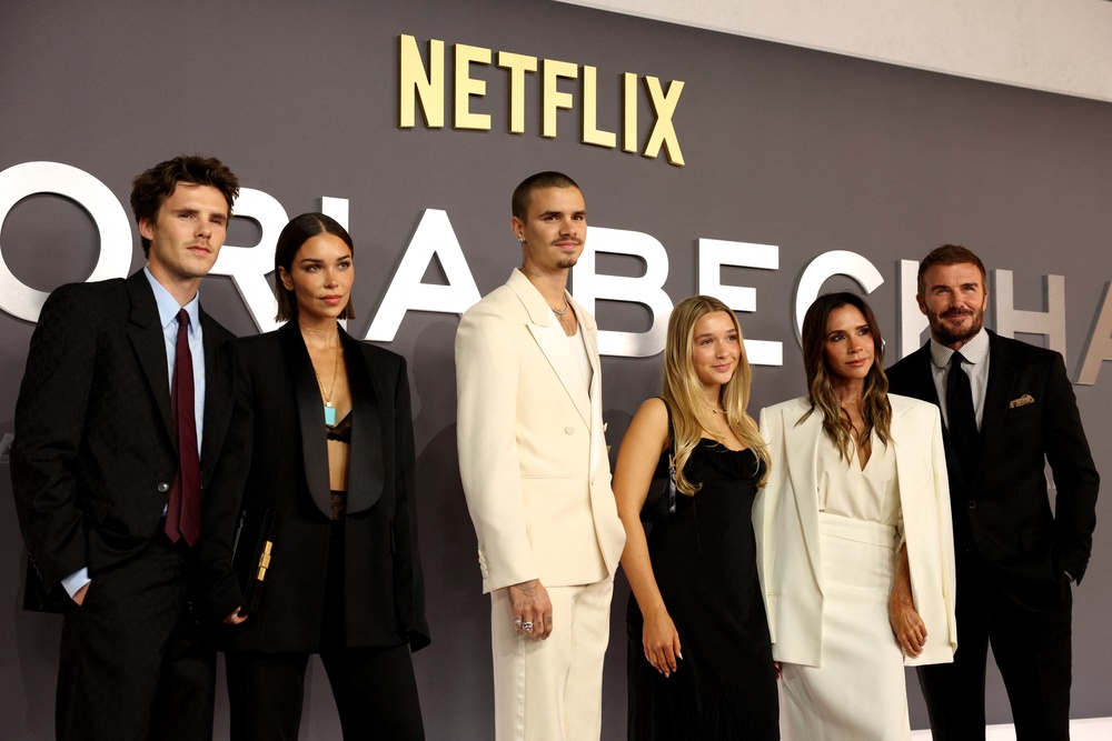 The Beckham family – minus Brooklyn – with Harper next to her mum at her documentary debut last year (AFP/Getty)