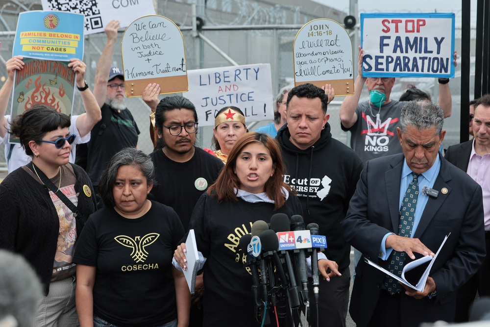 Gabriella Soto, whose husband is on a hunger strike, speaks out against conditions at Delaney Hall alongside New York Democratic Rep. Adriano Espaillat (right) after the congressman toured the facility May 27 (Getty)