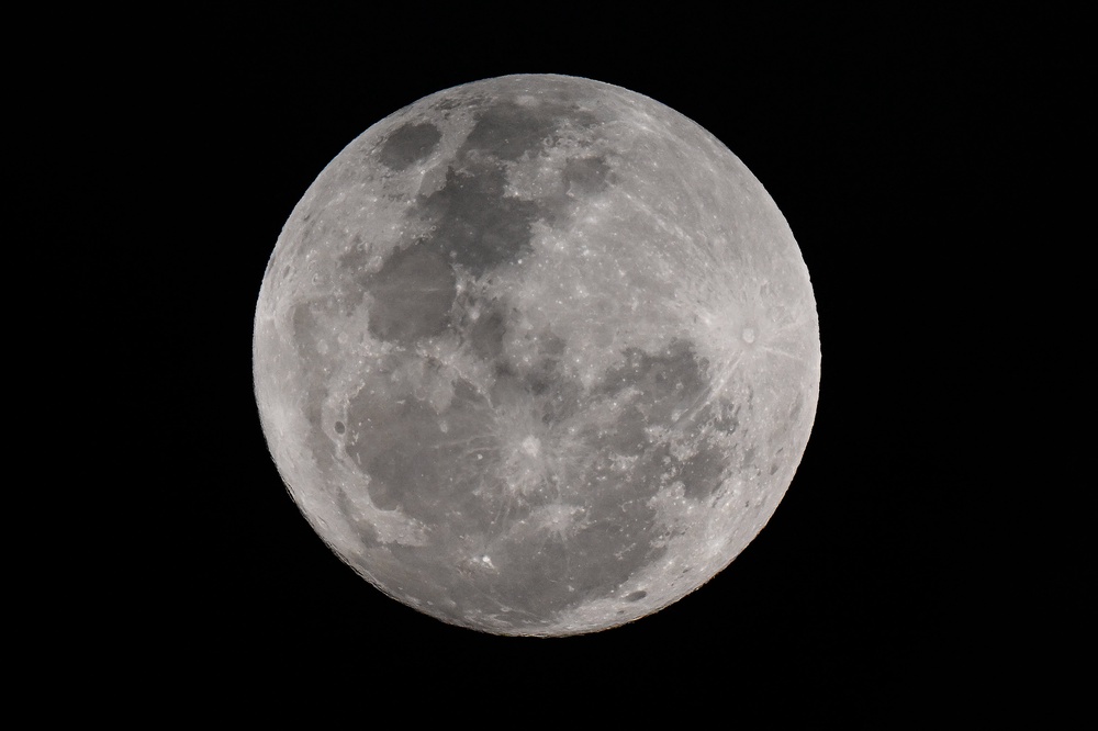 A rare blue supermoon appears in the night sky over Sydney, Australia, in August 2024. While the blue moon isn’t actually a blue hue, NASA says particles can make it appear blue (AFP/Getty)