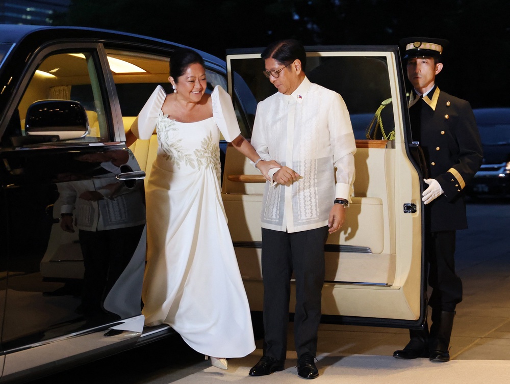 Philippine president Ferdinand Marcos Jr and first lady Liza Araneta Marcos arrive at the Imperial Palace in Tokyo on 27 May 2026 (AFP/Getty)