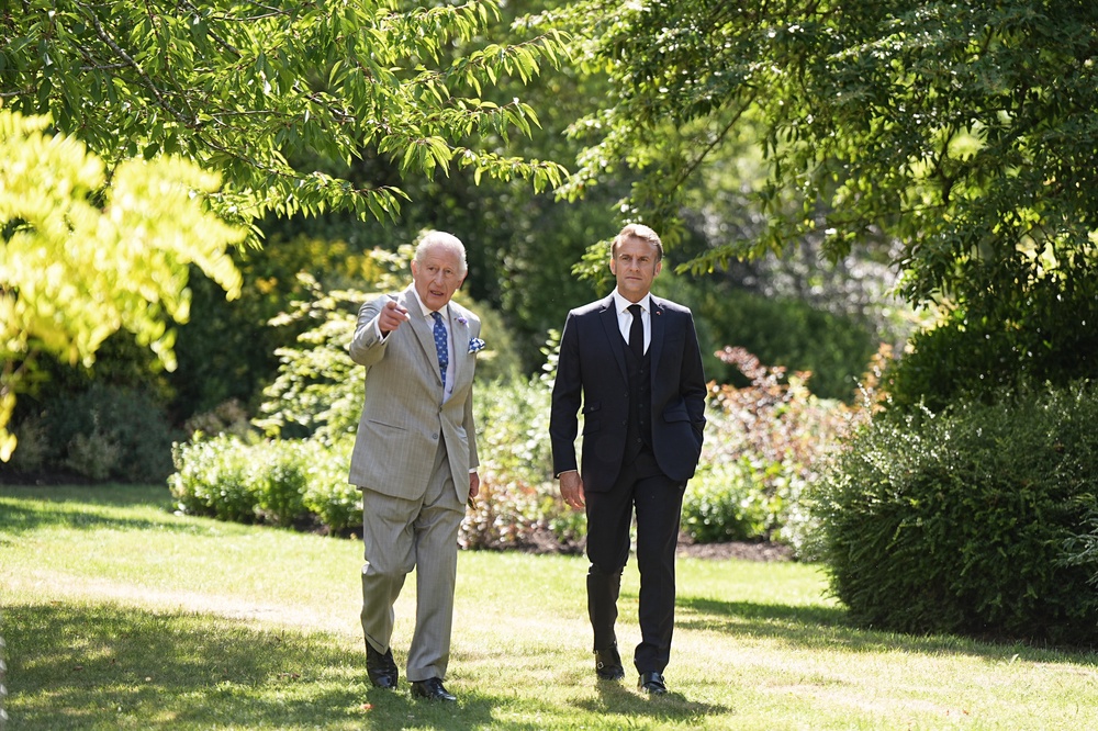 The King showing French President Emmanuel Macron one of the gardens at Windsor Castle during the state visit in 2025 (Aaron Chown/PA) (PA Archive)