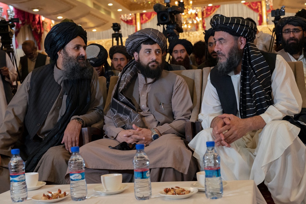 Afghanistan’s defence minister Mohammad Yaqoob (centre) and deputy prime minister Abdul Ghani Baradar (left) during a press event in Kabul (AFP/Getty)