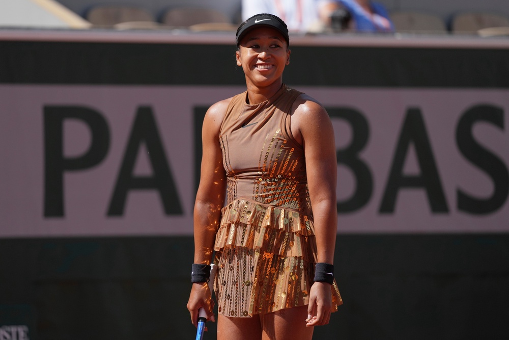 Glittering: The four-time Grand Slam champion wore copper on the court (AP)