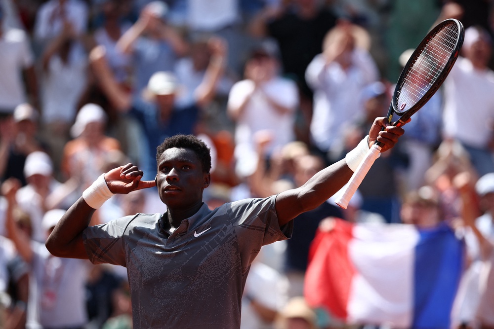Kouame whipped the crowd into a frenzy during his astonishing win to reach the third round (Reuters)