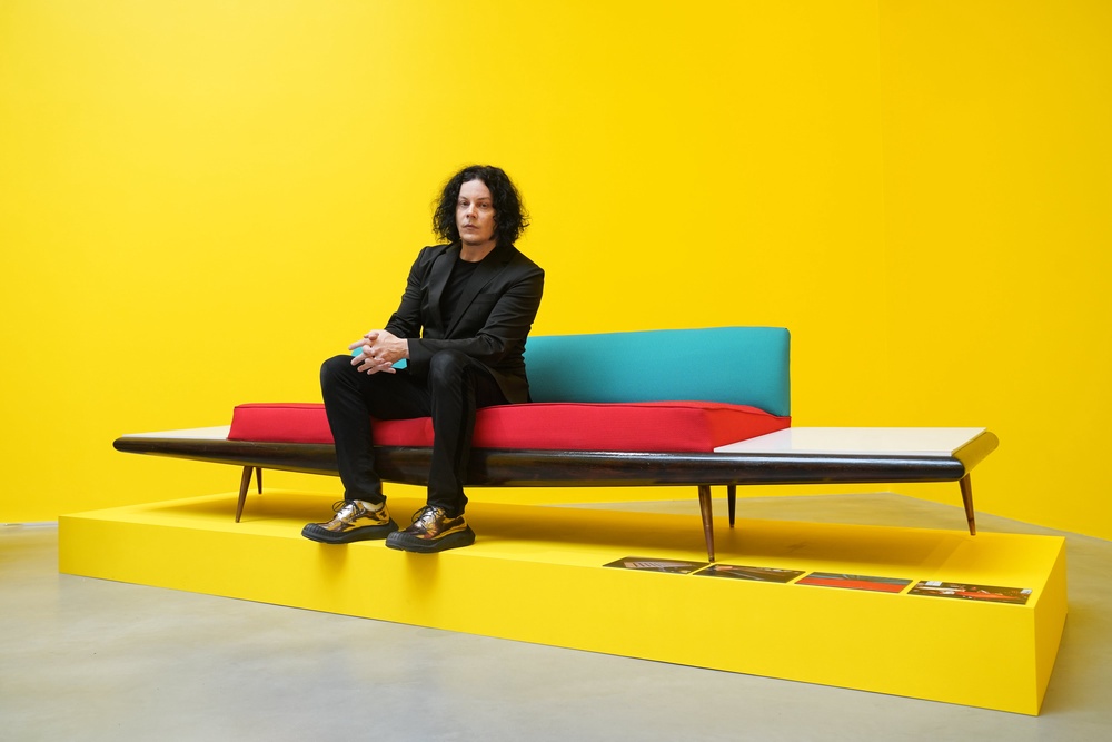Jack White with one of the pieces of furniture on display (Lucy North/PA) (PA Wire)