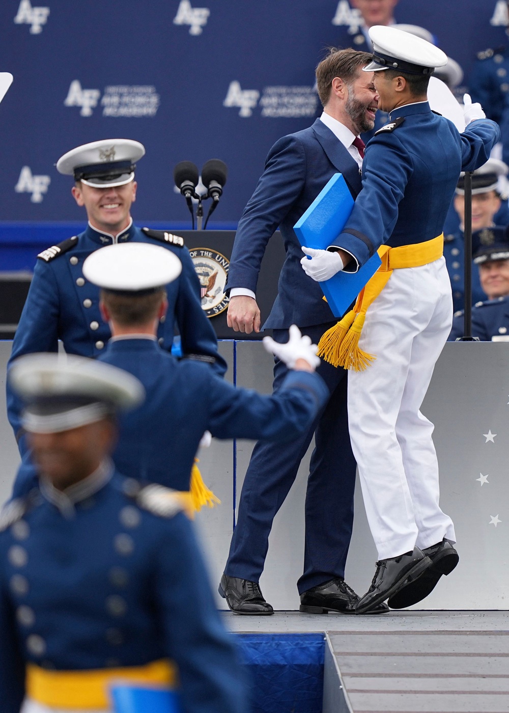 Vance chest bumps a graduating cadet during the 2026 graduation ceremony at the US Air Force Academy in Colorado Springs (POOL/AFP via Getty Images)