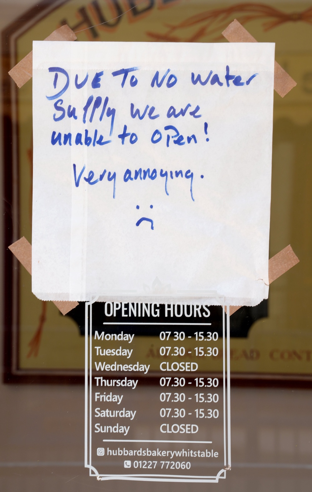 A sign announcing the temporary closure of a bakery in the shop window in Whitstable, Kent (PA)