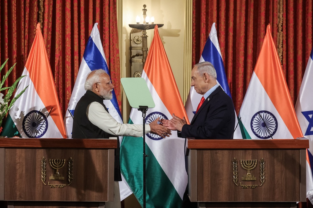 Israel's prime minister Benjamin Netanyahu shakes hands with his Indian counterpart Narendra Modi in Jerusalem on 26 February 2026 (AFP/Getty)